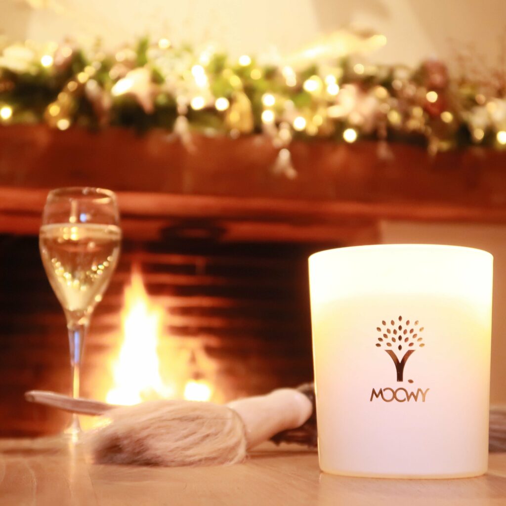 MOOWY Grass scented candle on a sidetable