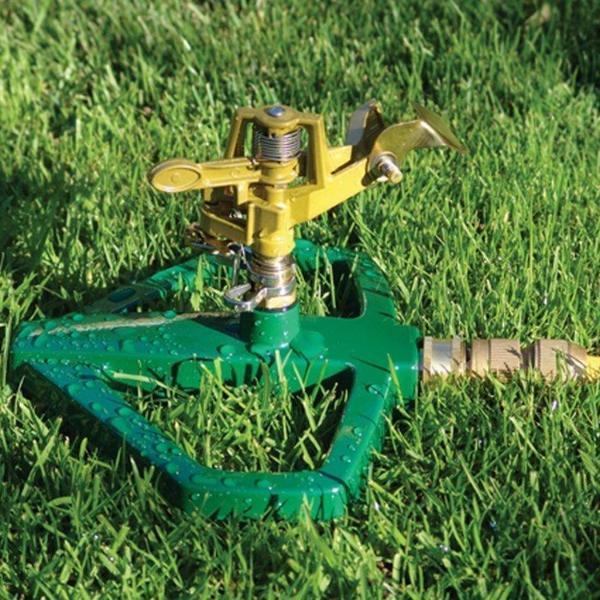 Sprinkler on feet on the lawn