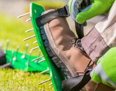 lawn aerator shoes with spikes on a lawn