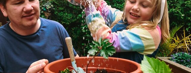 Family growing veg plants