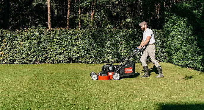 Louis Hooft mowing his lawn