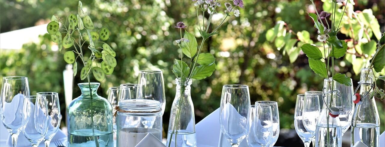 A garden dinner table, laid out for entertaining