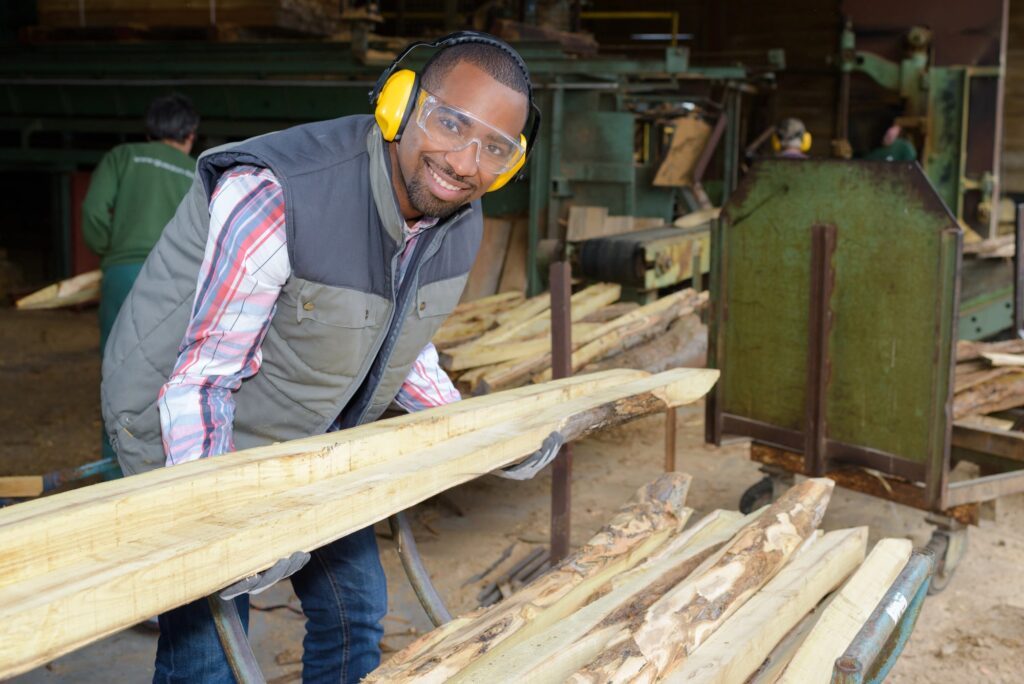 A man wearing safety goggles for wood work